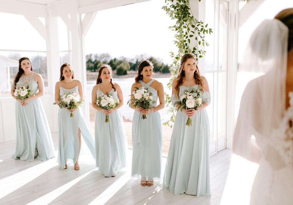 Bridal party wears sea glass bridesmaid dresses