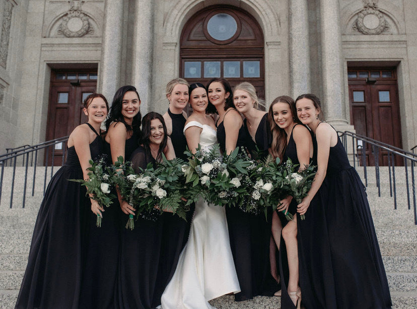 Bridal party wears black bridesmaid dresses