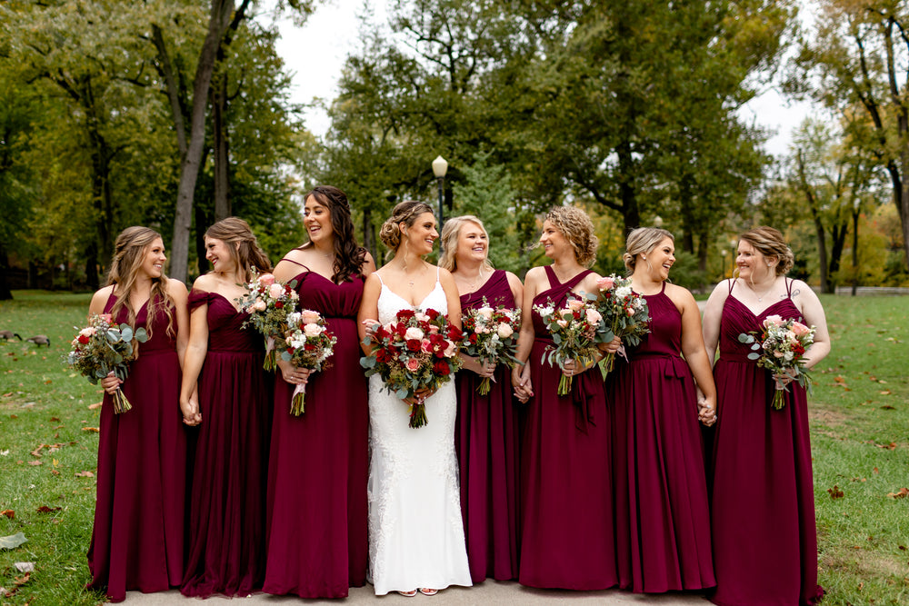 Bridal party wears bordeaux bridesmaid dresses