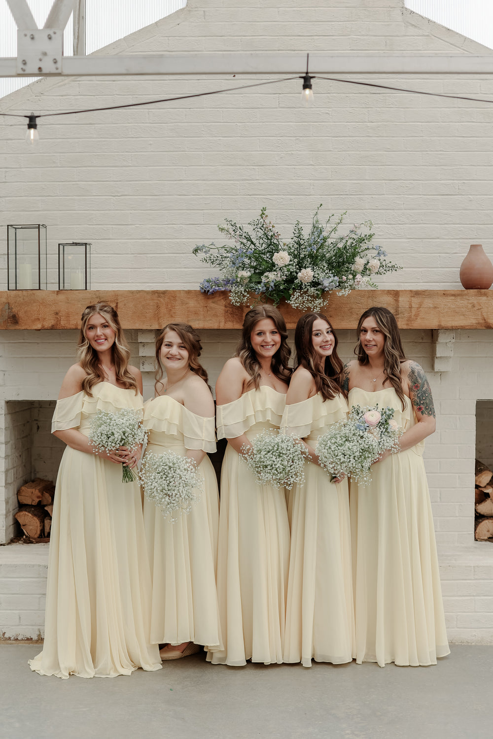 Bridal party wears buttercup yellow bridesmaid dresses