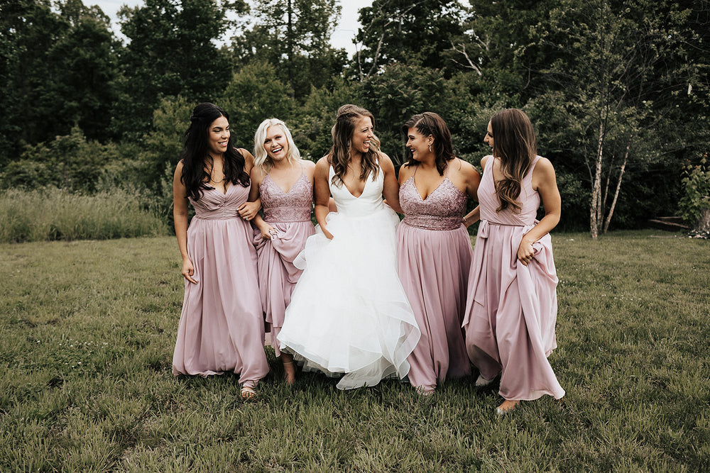 Bridal party wears desert rose bridesmaid dresses