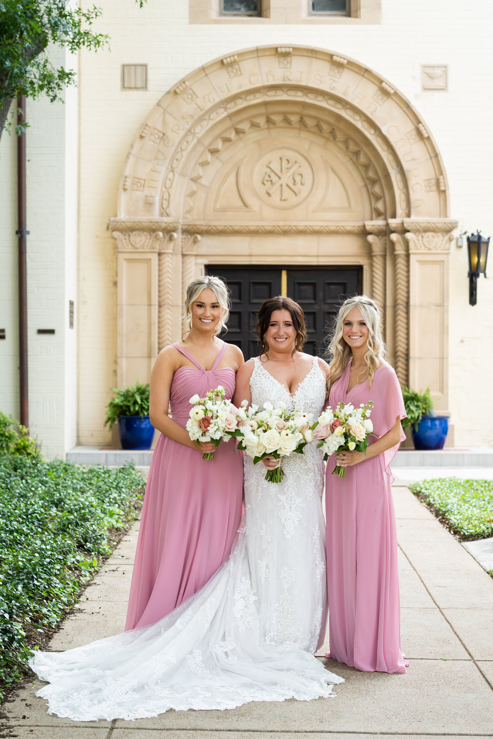 Bridal party wears dusty pink bridesmaid dresses