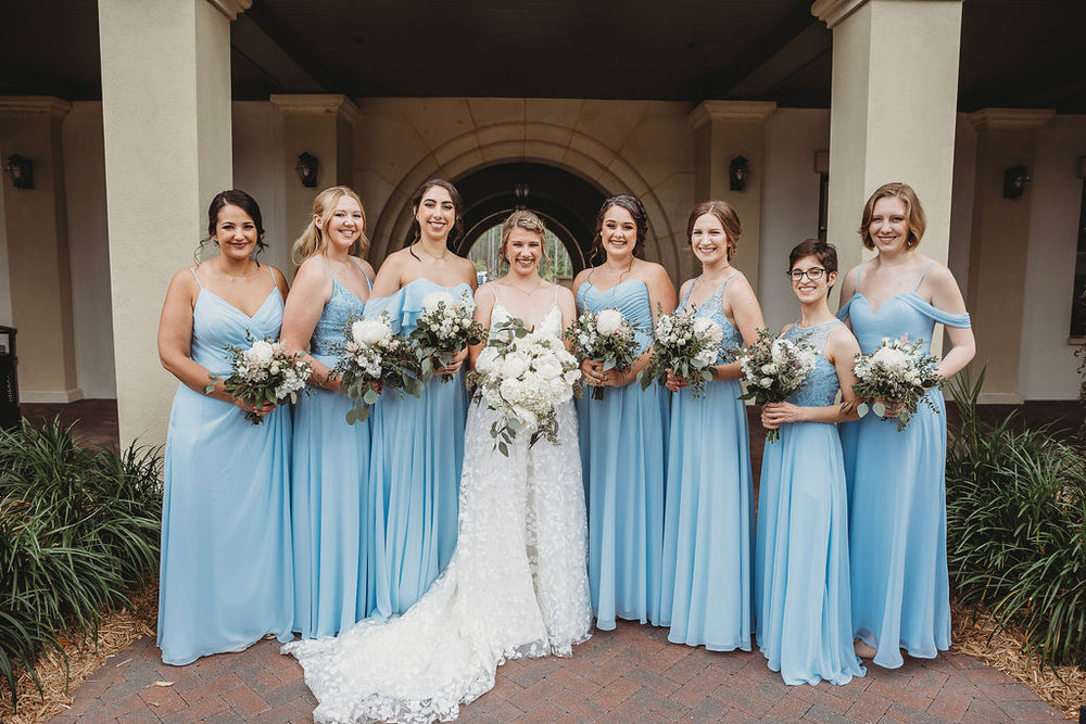 Bridal party wears sky blue bridesmaid dresses