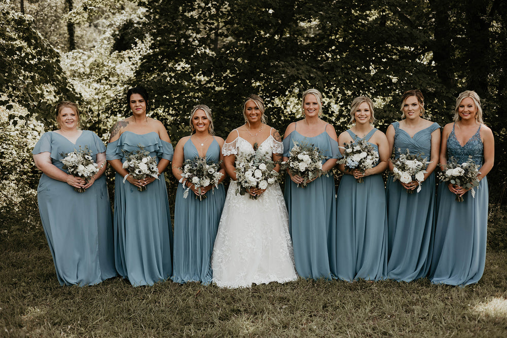 Bridal party wears slate blue bridesmaid dresses