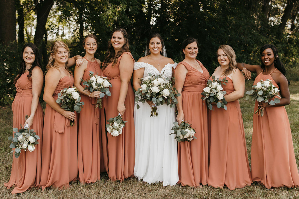 Bridal party wears spice bridesmaid dresses