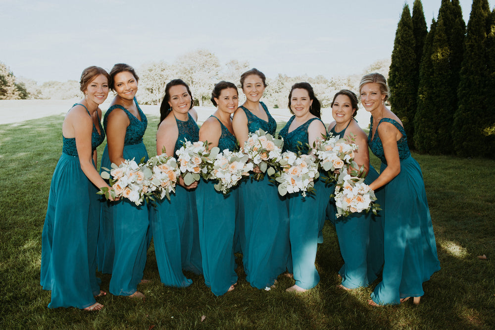 Bridal party wears teal bridesmaid dresses